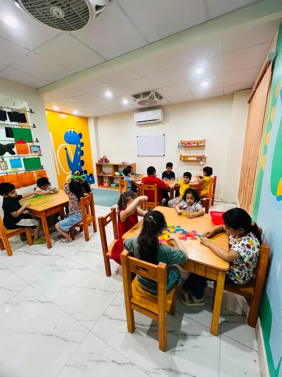 Children learning in a structured special education classroom at NEST, DHA Phase 2, Islamabad